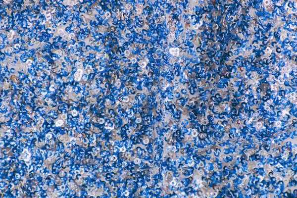 Texture in tessuto con paillettes bianche e blu. Primo piano . — Foto Stock