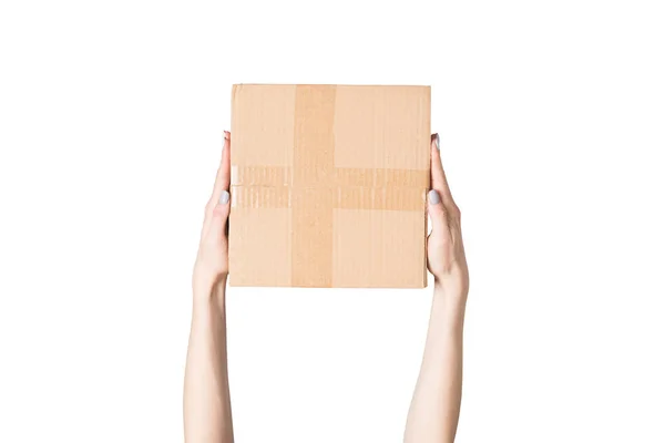 Paket in weiblicher Hand. Ansicht von oben. isolieren — Stockfoto