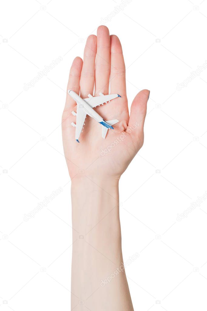 Airliner on the female palm isolate on white background. Concept of safe flights