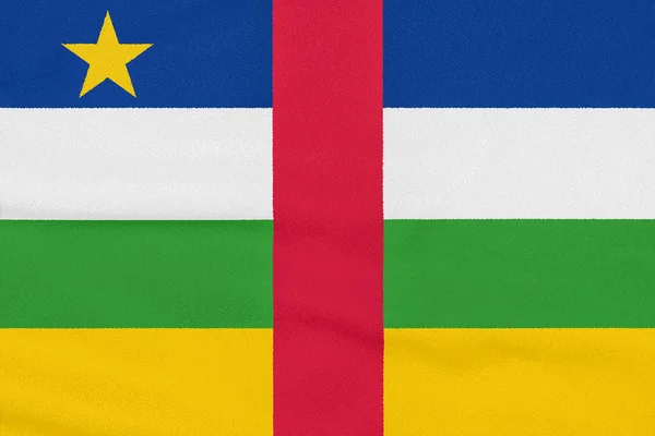 Bandeira da República Centro-Africana sobre tecido texturizado. Símbolo patriótico — Fotografia de Stock