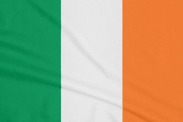 Flaga Irlandii na teksturowanej tkaniny. Symbol patriotyczny — Zdjęcie stockowe
