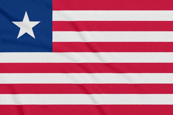 Flag of Liberia on textured fabric. Patriotic symbol — Stock Photo, Image