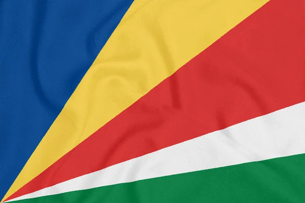 Bandera de Seychelles sobre tela texturizada. Símbolo patriótico — Foto de Stock