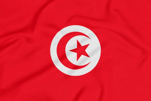 Σημαία της Τυνησίας σε υφή υφάσματος. Πατριωτικό σύμβολο — Φωτογραφία Αρχείου
