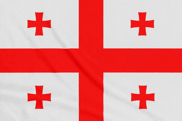 Bandeira da Geórgia em tecido texturizado. Símbolo patriótico — Fotografia de Stock