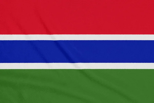 Flagge von Gambia auf texturiertem Stoff. Patriotisches Symbol — Stockfoto
