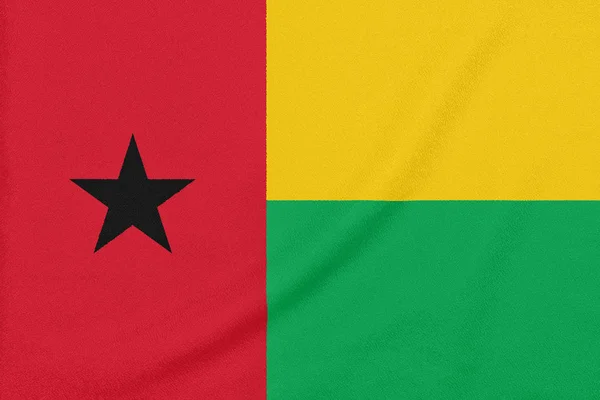 Drapeau de Guinée-Bissau sur tissu texturé. Symbole patriotique — Photo