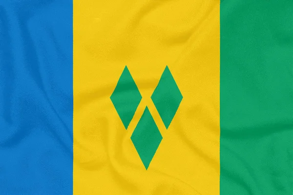 Flaga Saint Vincent i Grenadyny na tkaniny teksturowanej. Symbol patriotyczny — Zdjęcie stockowe