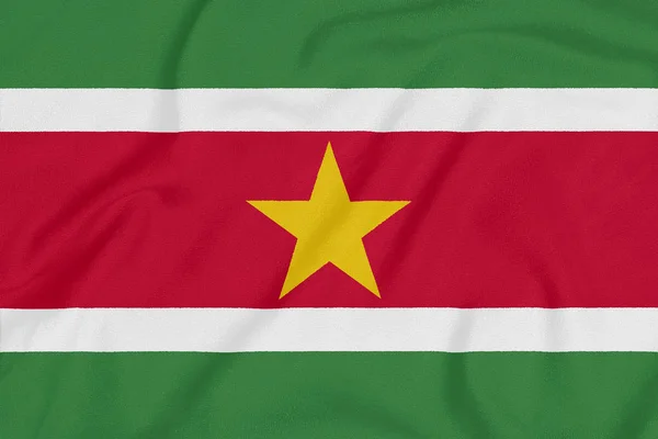 Vlag van Suriname op getextureerde stof. Patriottisch symbool — Stockfoto