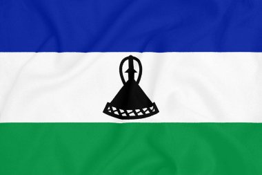 Dokulu kumaş üzerinde Lesotho bayrağı. Vatansever sembolü