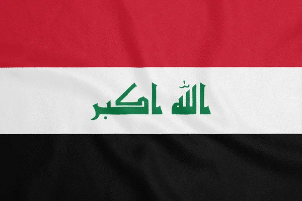 Bandera de Irak sobre tela texturizada. Símbolo patriótico — Foto de Stock