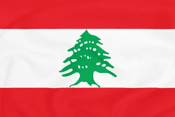 Flag of Lebanon on textured fabric. Patriotic symbol — Stock Photo, Image