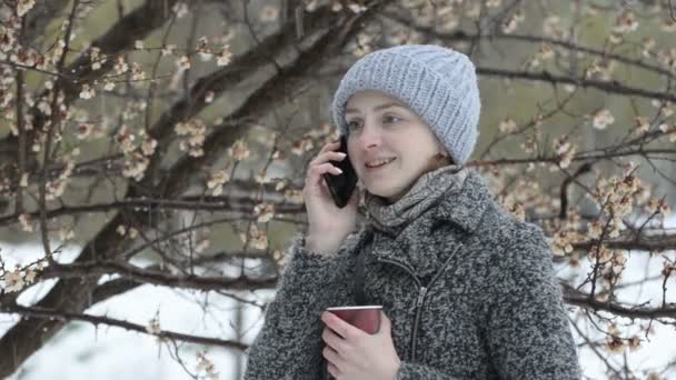 Young Woman Talking Phone Paper Cup His Hands Blooming Tree — Stock Video