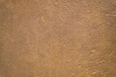 Bulanık altın kahverengi alçı duvar. Arka planlar ve dokular