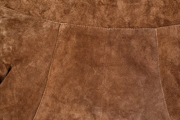 Part of brown textured suede clothing. Genuine leather — Stock Photo, Image