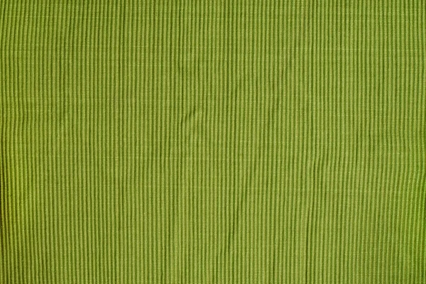 Zelená, tvarovaná bavlněná tkanina. Struktura žebrování. Plné hladké pozadí. — Stock fotografie