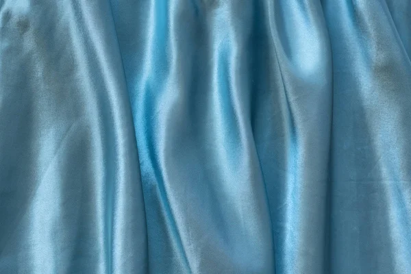 Блакитний шовк зім'ятий тканини. Тло текстури — стокове фото
