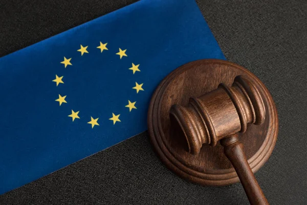 Judge gavel and European Union flag. Jurisprudence in Europe. Legality concept.