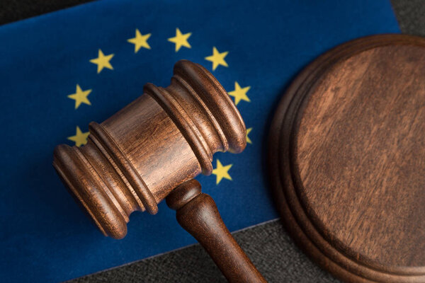 Judge gavel over European Union flag. Training jurisprudence in Europe. Legality concept.