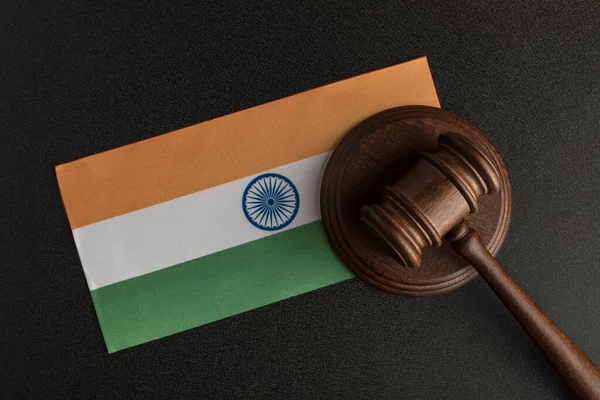 Judge Gavel and flag of India . Violation of human rights. Protection of rights population.