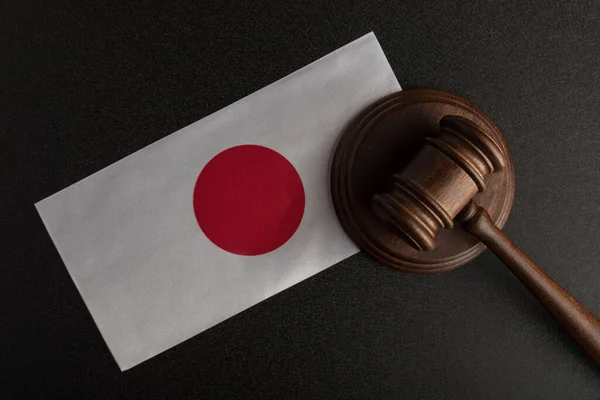 judges hammer and flag of Japan. Law of Japan. Violation of rights.
