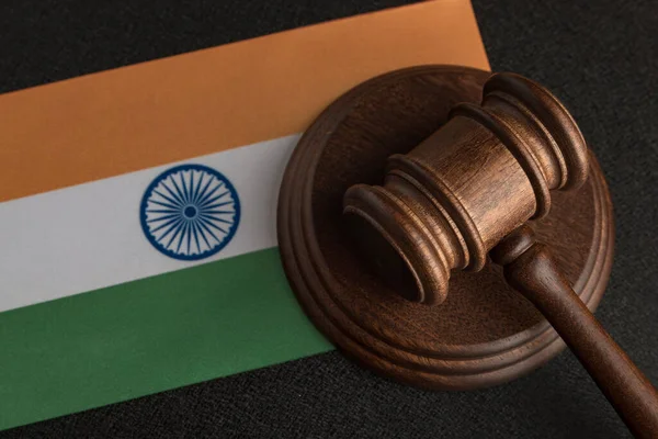 Judge Gavel and flag of India . Violation of human rights. Law and justice.