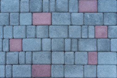 Gri ve kırmızı tuğlalardan bir duvar. Tuğla işi. İnşaat arkaplanı