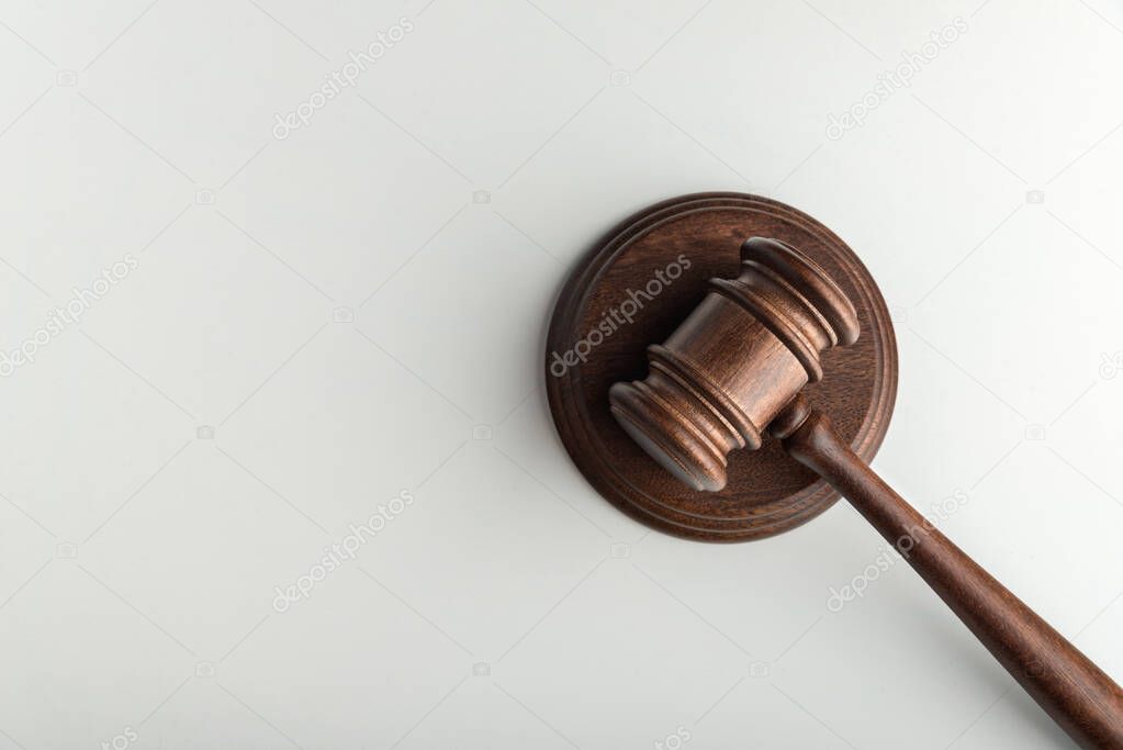 Wooden judge gavel and sound Board on white background. Top view. Auction. Symbol of justice and trial.