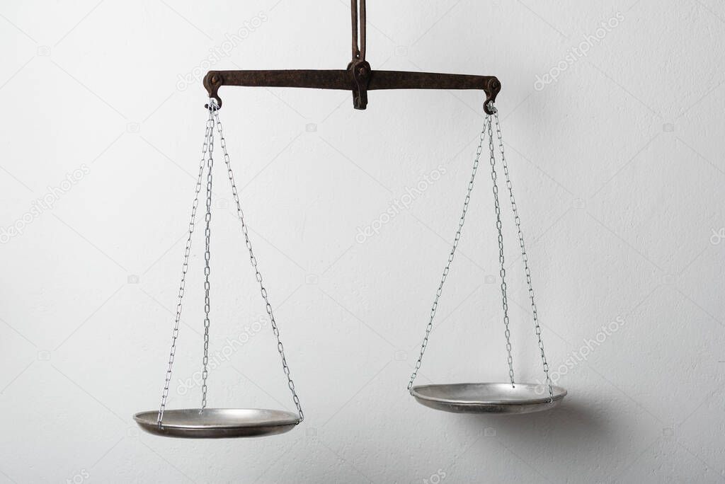 Silver balance scale or beam balance on white background. Laboratory scales.