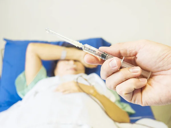 Doctor Holding Syringe Hand Ready Injecting Patient Background Hospital — Stock Photo, Image