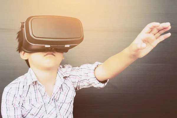 7 years kid playing VR virtual reality game