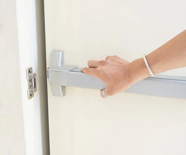 Hand Pushing Opening Emergency Fire Exit Door — Stock Photo, Image