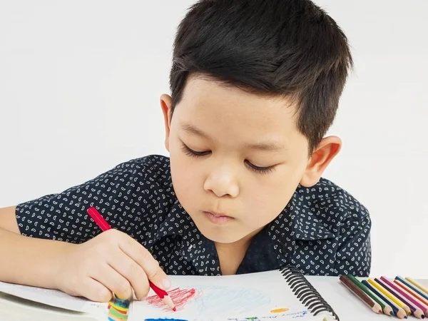 Asian Boy Curiously Doing Homework — Stock Photo, Image