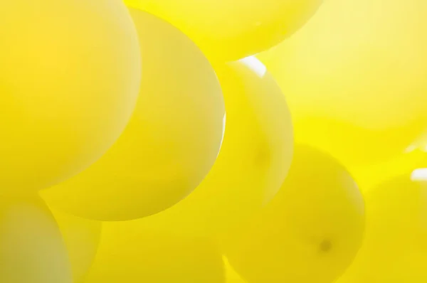 Yellow balloon in sunlight for background use