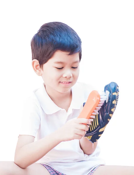Niño Está Felizmente Limpiando Zapato Aislado Sobre Fondo Blanco — Foto de Stock