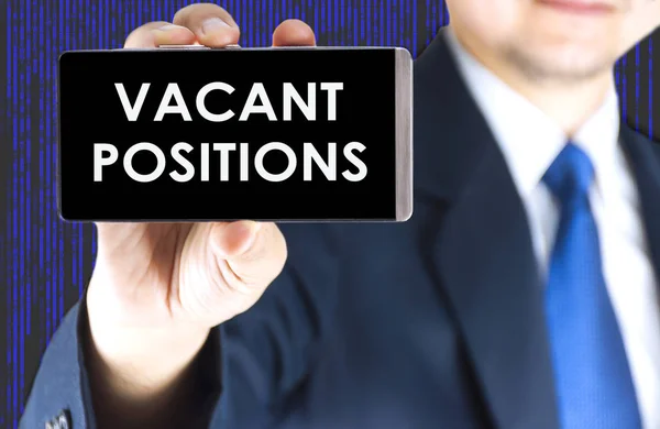 Vacant Positions Word Mobile Phone Screen Blurred Young Businessman Hand — Stock Photo, Image