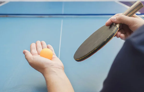 A man play table tennis ready to serve