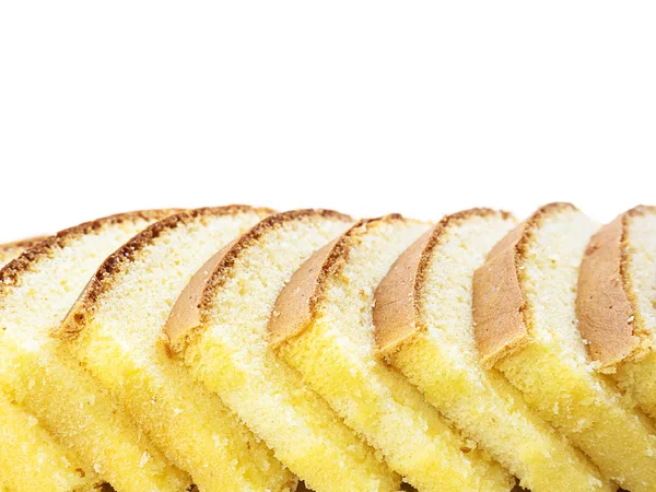 Row of inclined sliced butter cake isolated over white