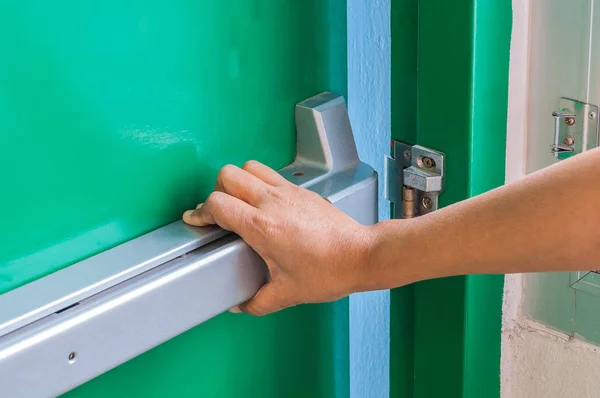 Hand Pushing Opening Emergency Fire Exit Door Life Protection Survive — Stock Photo, Image