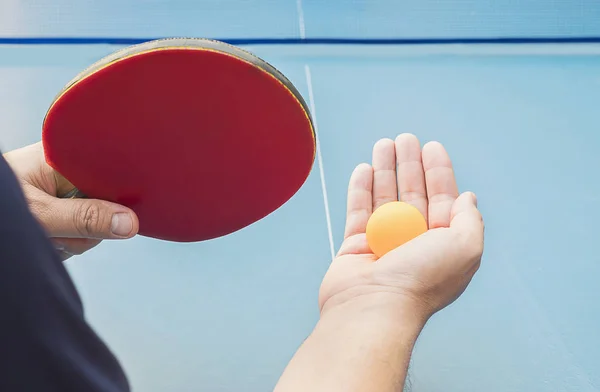 A man play table tennis ready to serve