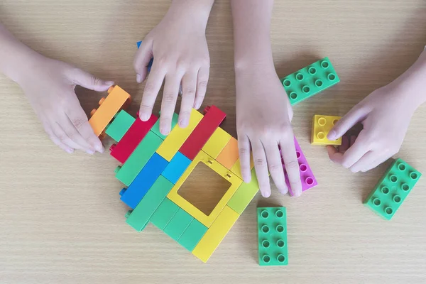 Kids playing pieces plastic creative construction blocks