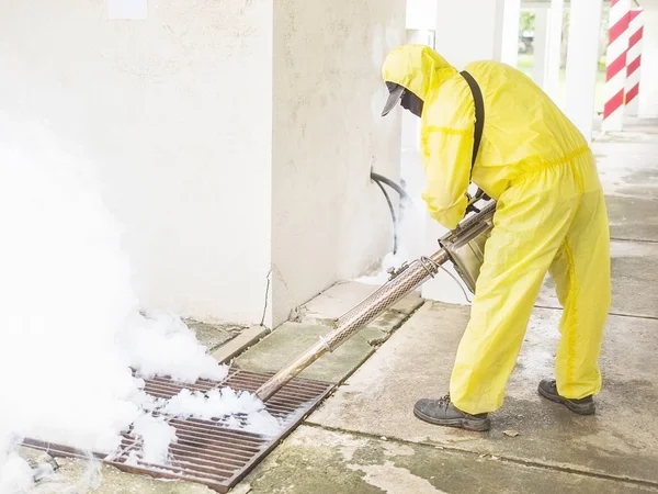Man is using thermal fog machine to protect mosquito spreading