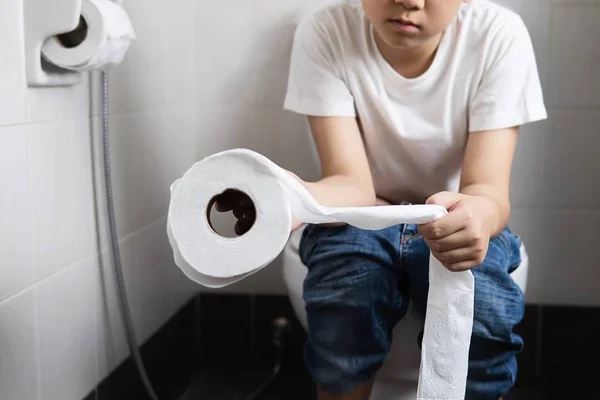 Asian Boy Sitting Toilet Bowl Holding Tissue Paper Health Problem — Stock Photo, Image