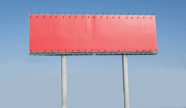 Empty red highway billboard over blue sky background, your text here