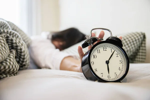 Sleepy Woman Reaching Holding Alarm Clock Morning Late Wake Every — Stock Photo, Image