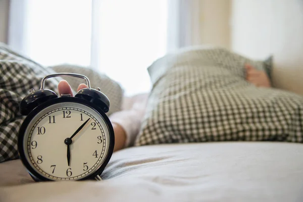 Sleepy Woman Reaching Holding Alarm Clock Morning Late Wake Every — Stock Photo, Image
