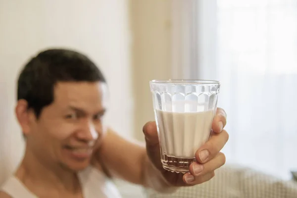 Asian man drink milk after wake up in the morning sitting on a bed - health  care concept | Stock Images Page | Everypixel