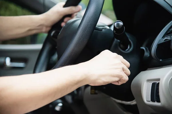 Man start car use a key - people using car in everyday life concept