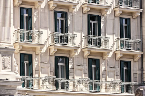 Facade of the historic flat house with balconies