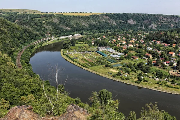 Curved meander of the Vltava river with the gardens and buildings